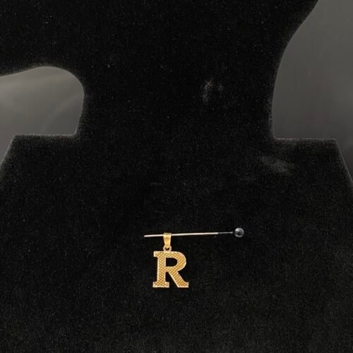 حرف ذهب عيار 18 حرف R بوزن 0.24 جرام | قمة زاوية الشفاء للذهب والمجوهرات